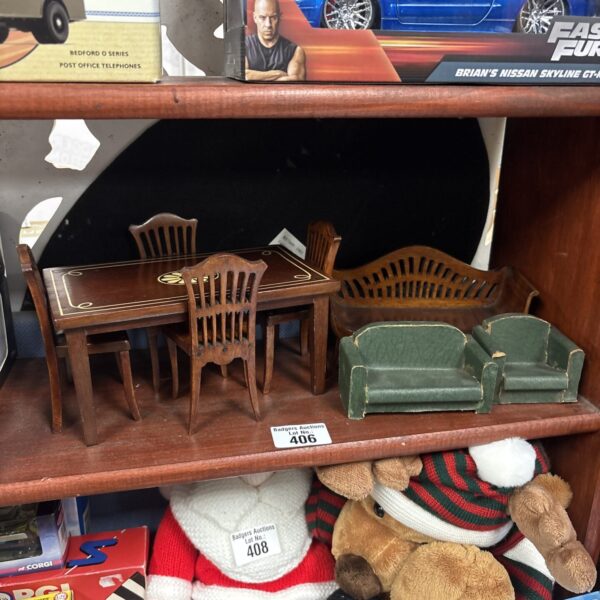Vintage dollhouse furniture set with table and chairs.