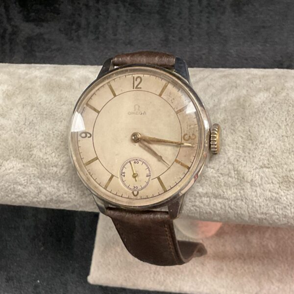 Vintage Omega gents watch with Arabic numerals.