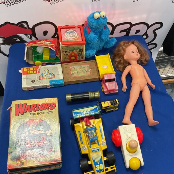 Mixed lot of Warlord books and vintage toys for collectors.