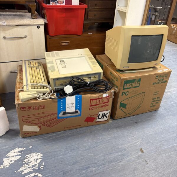 Boxed Amstrad PC-CD Computor system with monitor and accessories.
