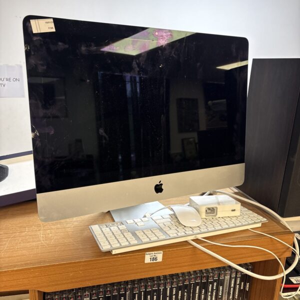 Vintage Apple iMac A1418 desktop computer with keyboard and mouse.