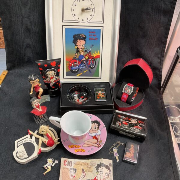 Vintage Betty Boo collectible lot with wristwatch and figures.