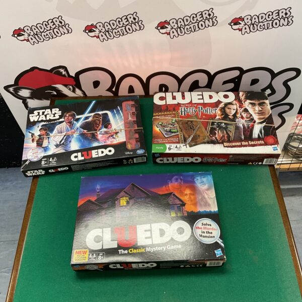 Lot of three Cluedo board games, including Star Wars and Harry Potter editions.