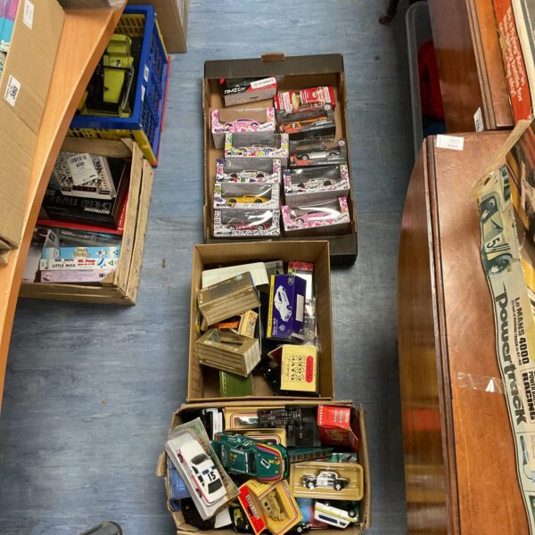 Mixed lot of vintage and modern diecast model cars in boxes.