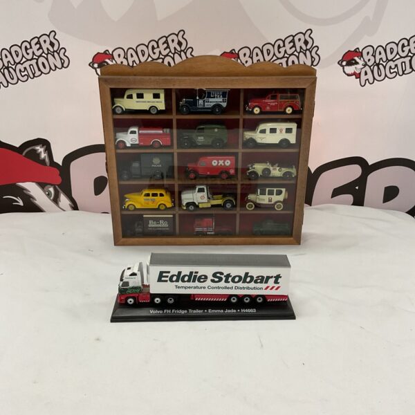 Diecast model collection in a glass-fronted wooden display case.