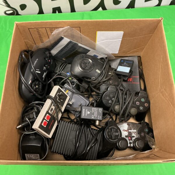 Mixed lot of retro gaming controllers including Sega, Xbox, and Nintendo.