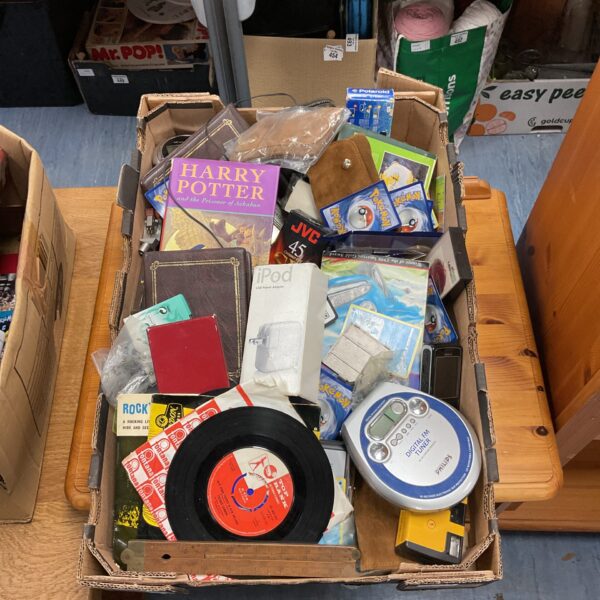 Mixed lot of house clearance items including Pokemon cards and books.