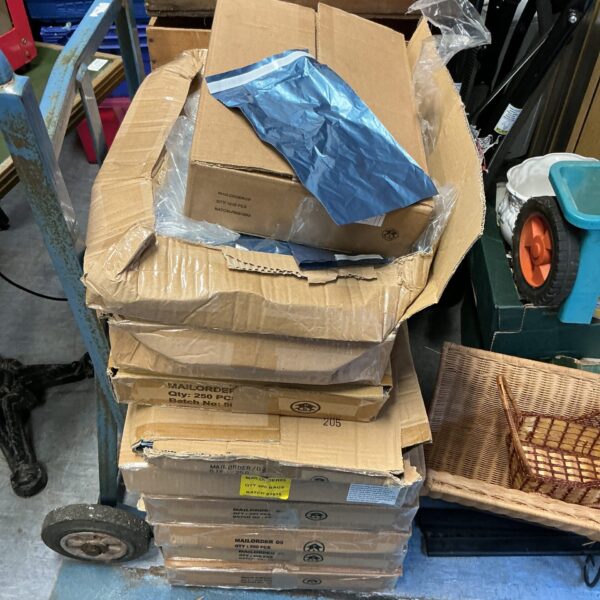 Bulk lot of clear plastic mail order bags for packaging.