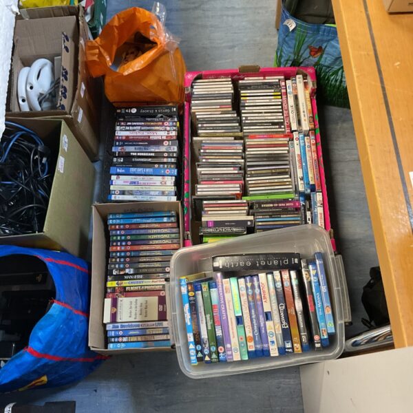 Large mixed lot of CDs and DVDs for home entertainment.