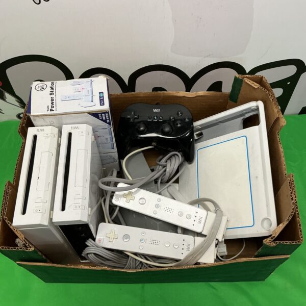 Nintendo Wii console bundle with controllers and cables for retro gaming.