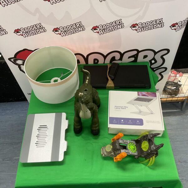 Blu-ray player, laptop stands, lampshade, and dinosaur toy bundle.