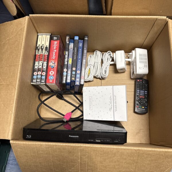 Panasonic Blu-Ray player with Blu-Ray discs in open box.