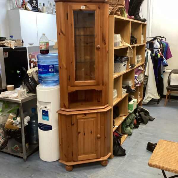 Vintage pine corner display cabinet with glass front.