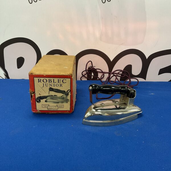 Vintage Roblec Junior clothes iron, a collectible household item.