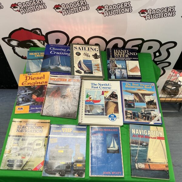 Lot of vintage sailing reference books for nautical enthusiasts.