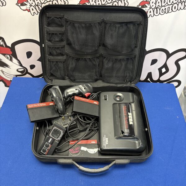 Front view of a Sega Master System Two console with controller and accessories.