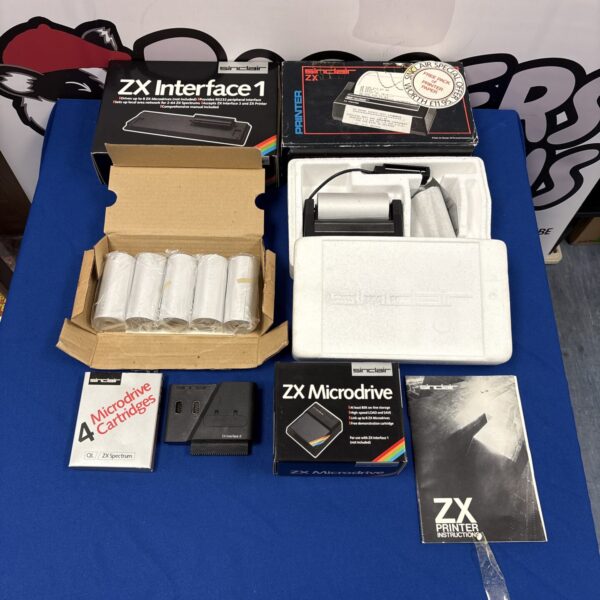 Vintage Sinclair ZX Spectrum accessories including interface, microdrive and printer.