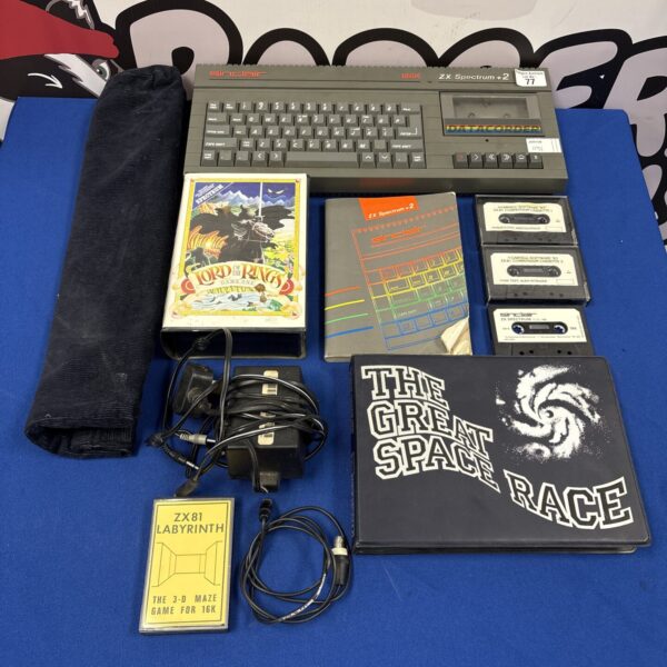 Front view of a Sinclair ZX Spectrum +2 128K home computer with games.
