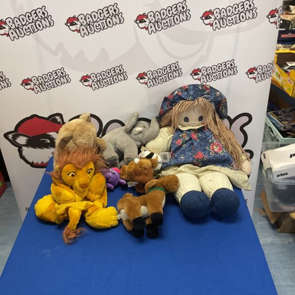 Stuffed animal lot featuring a Lion King plush toy.
