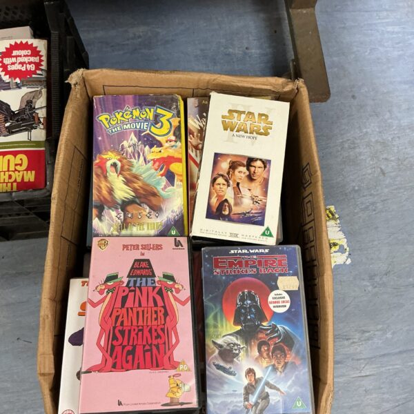 Vintage VHS cassette collection featuring Star Wars tapes.