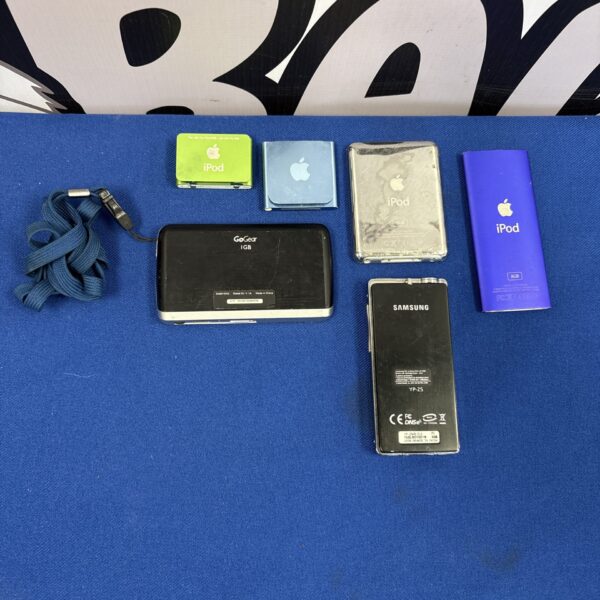 Overview of a vintage iPod collection with various Apple and Phillips devices.