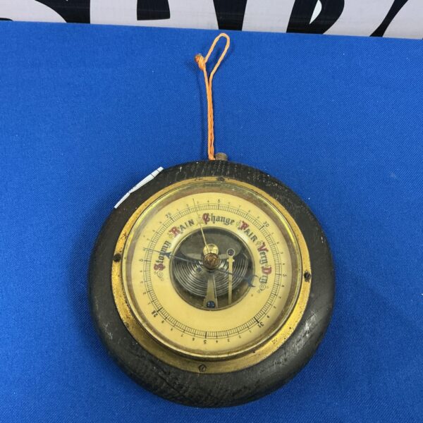 Vintage Lufft barometer with brass casing and dial.