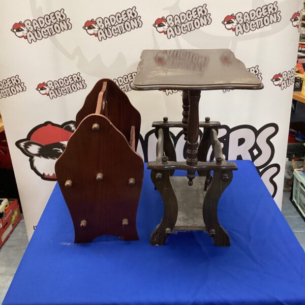 Vintage wooden magazine rack table with tiered shelving.