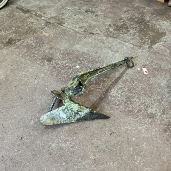 Vintage cast iron plough drag anchor for nautical collection.
