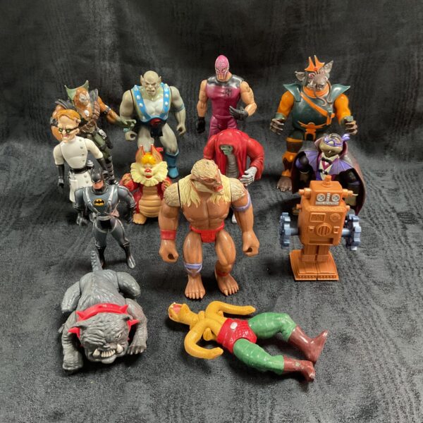 Vintage lot of assorted superhero action figures from the 1980s.