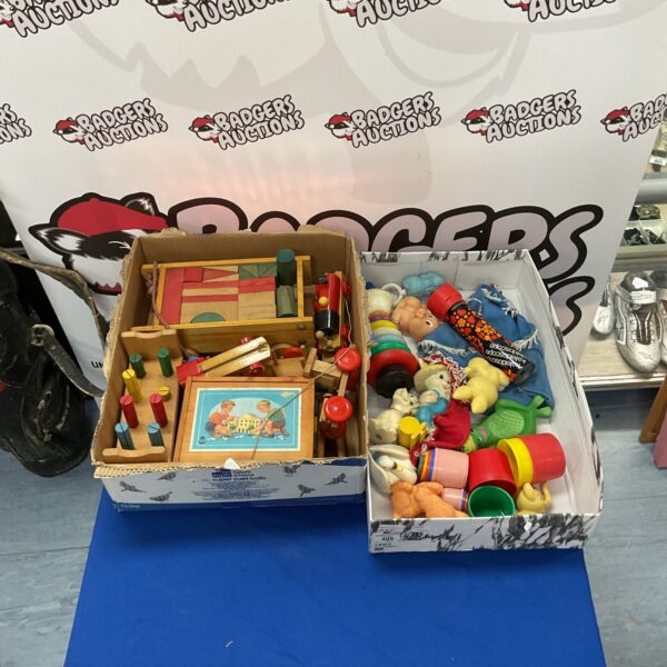 Vintage toy lot with a wooden train and colourful playthings.