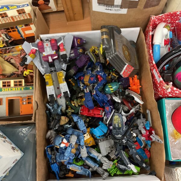 Mixed lot of vintage Transformers toys from the 1980s.