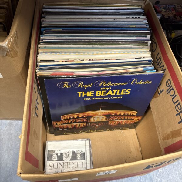 Mixed lot of vinyl records and CDs for music collectors.