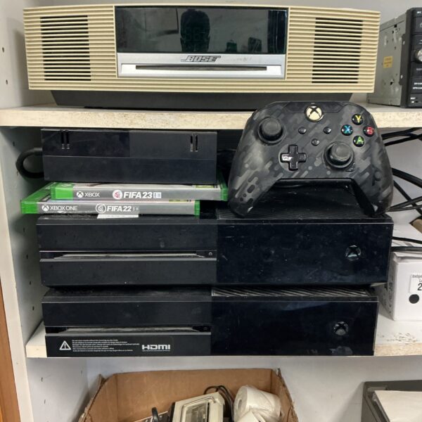 Xbox One console bundle with controllers and power supply.