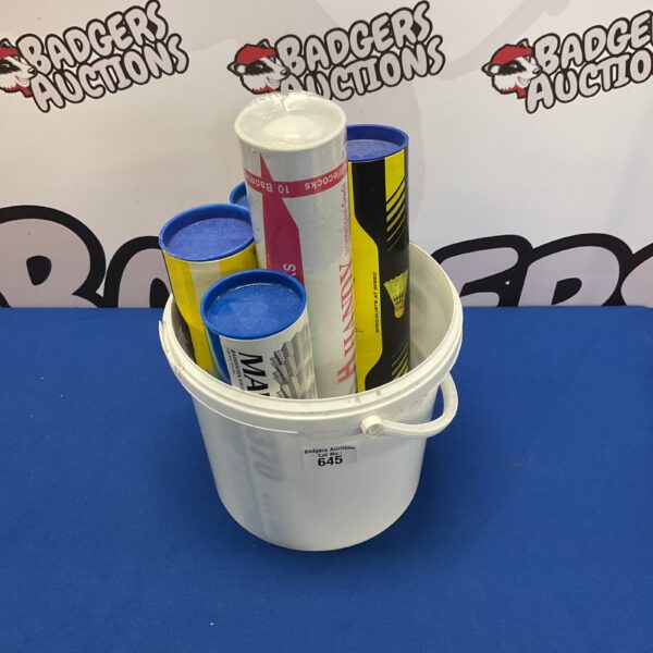 Bulk lot of badminton shuttlecocks in plastic tubes.