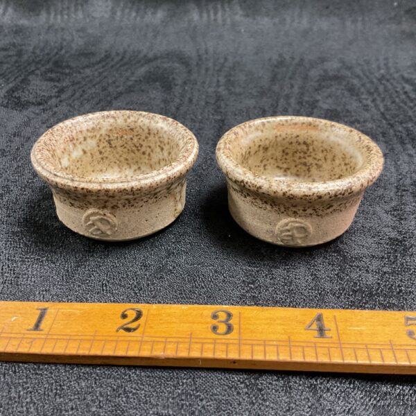 Pair of Bernard Leach studio pottery salt dishes with textured glaze.