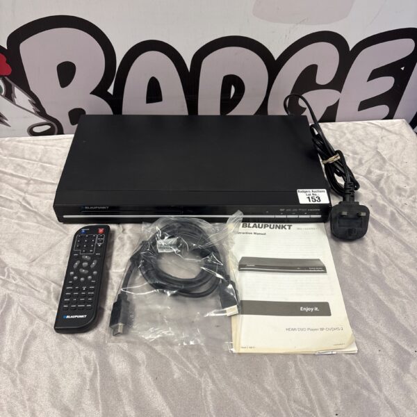 Black Blaupunkt DVD player with remote and cables for home cinema.