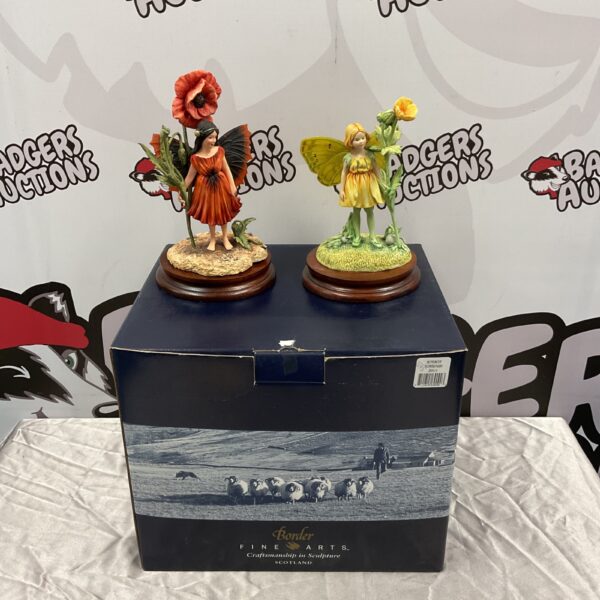 Border Fine Arts fairy figurine with a vibrant red poppy.