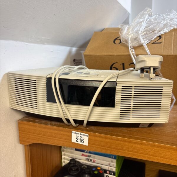 Vintage Bose Wave radio CD player tabletop audio system.