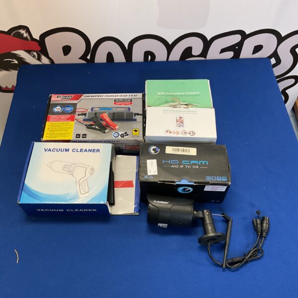 Mixed lot of car battery charger, security camera, and vacuum cleaner.