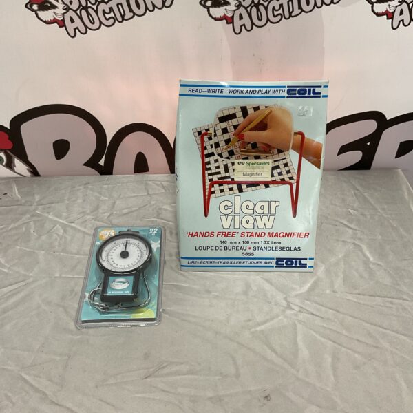 Coil hands free magnifier with built-in 22kg luggage scale.