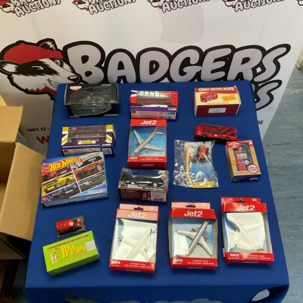 Overview of a diverse diecast model collection including cars, buses, and planes.