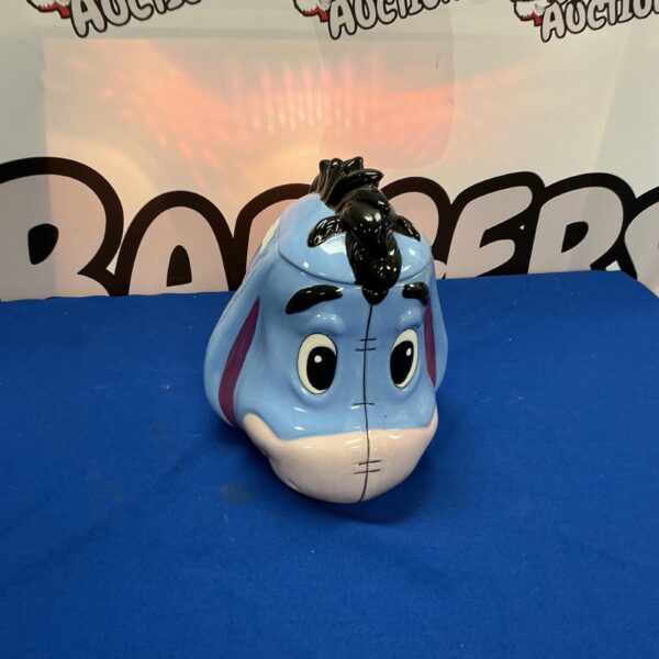 Blue ceramic Eeyore cookie jar from Disney’s Winnie the Pooh.