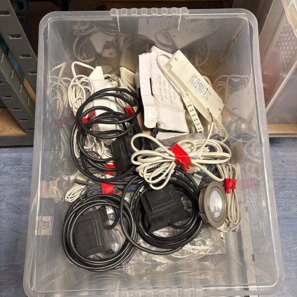 Mixed lot of downlights and power driver units for electrical projects.