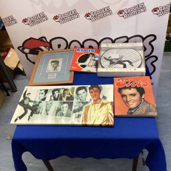 Vintage Elvis Presley memorabilia including a vinyl record clock and framed picture.