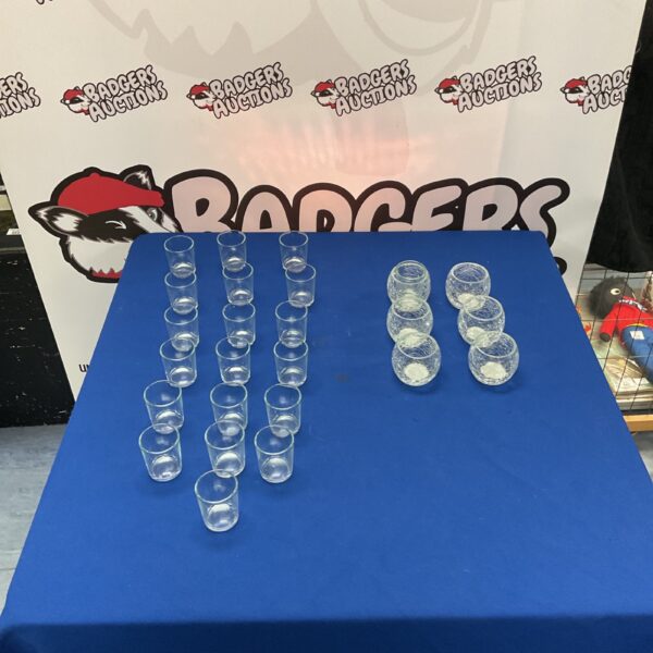 Collection of glass candle holders with crackled and smooth glass.