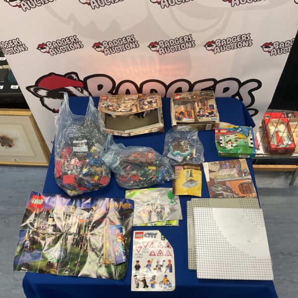 Assorted Lego bricks and empty Harry Potter boxes in a lot.