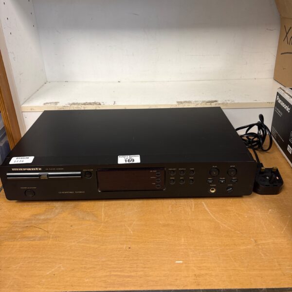 Silver Marantz CD player, vintage audio equipment.