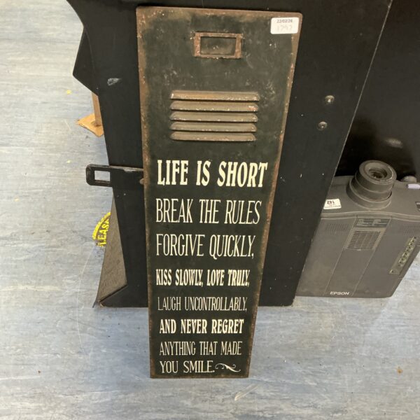 Vintage metal wall plaque with "Life is Short" inscription.