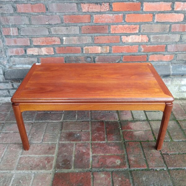 Vintage mid-century teak coffee table with simple rectangular design.