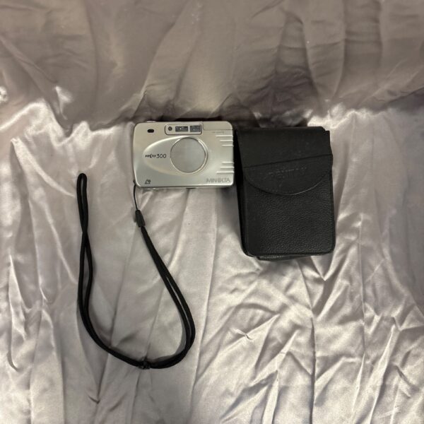 Vintage Minolta Vectis 300 camera with strap, side view.